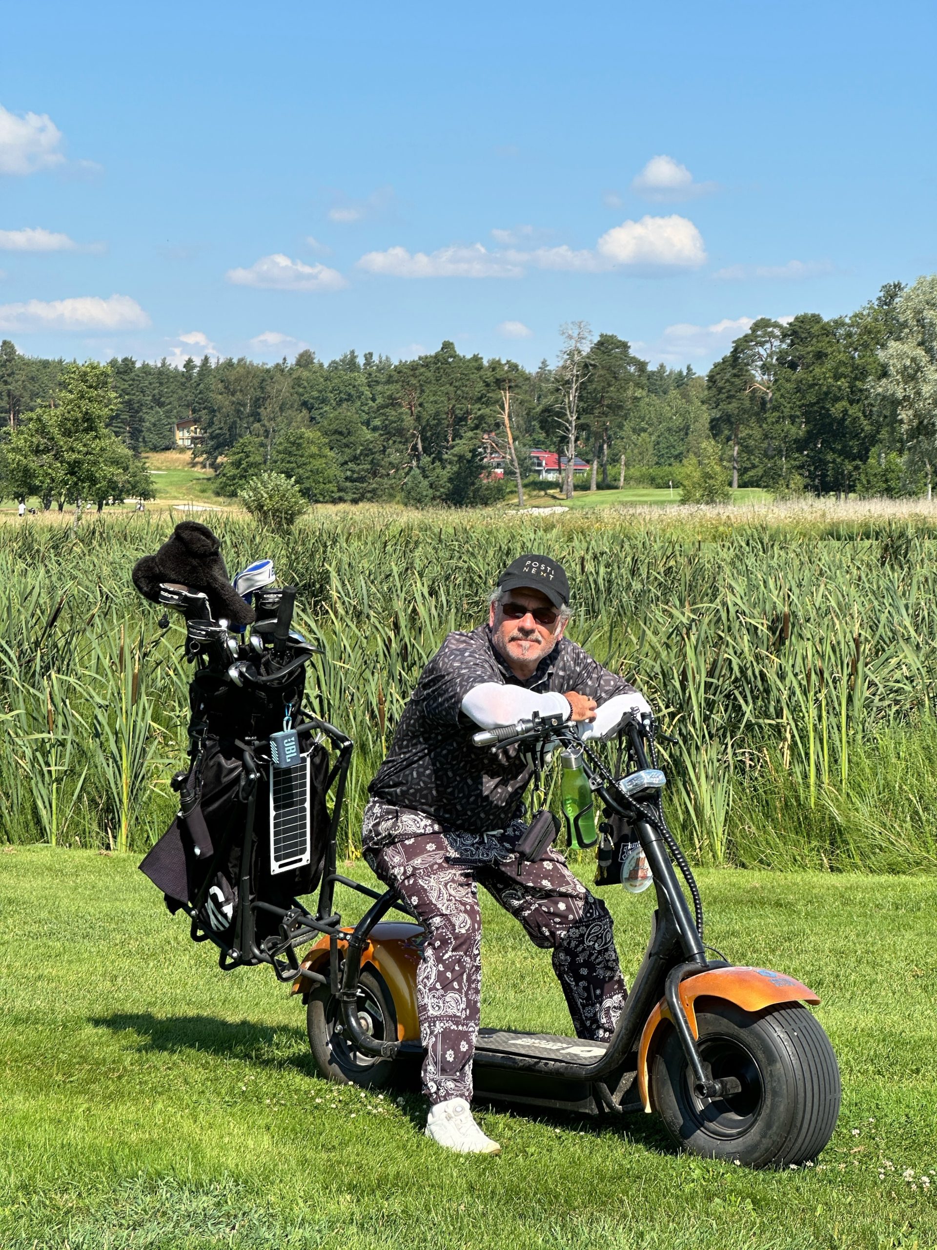 golfer on a scooter